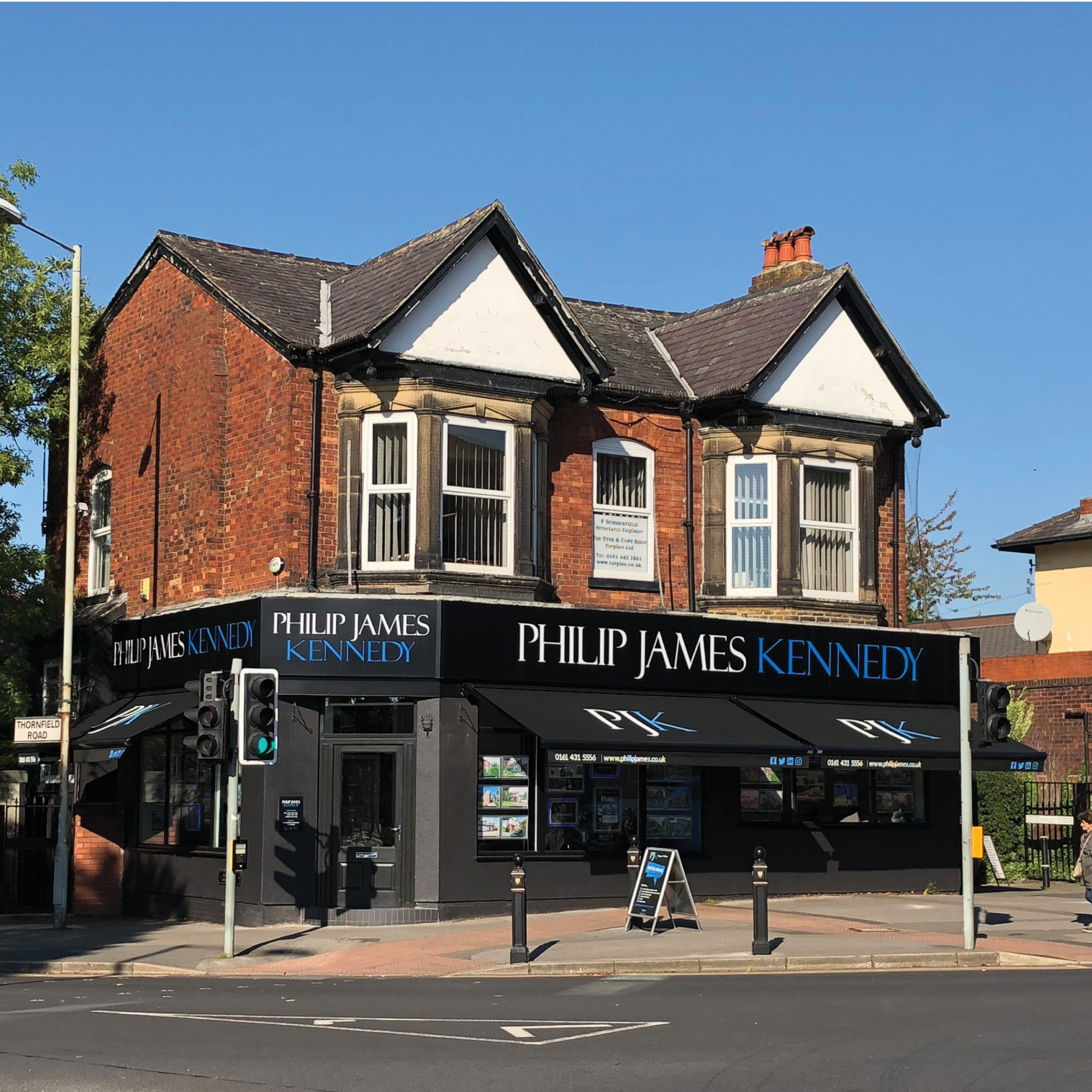 Photo of our Heaton Moor office on a sunny day