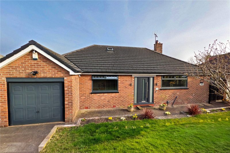 Exceptional four bedroom detached bungalow with panoramic valley views, versatile living space and stunning tiered gardens.