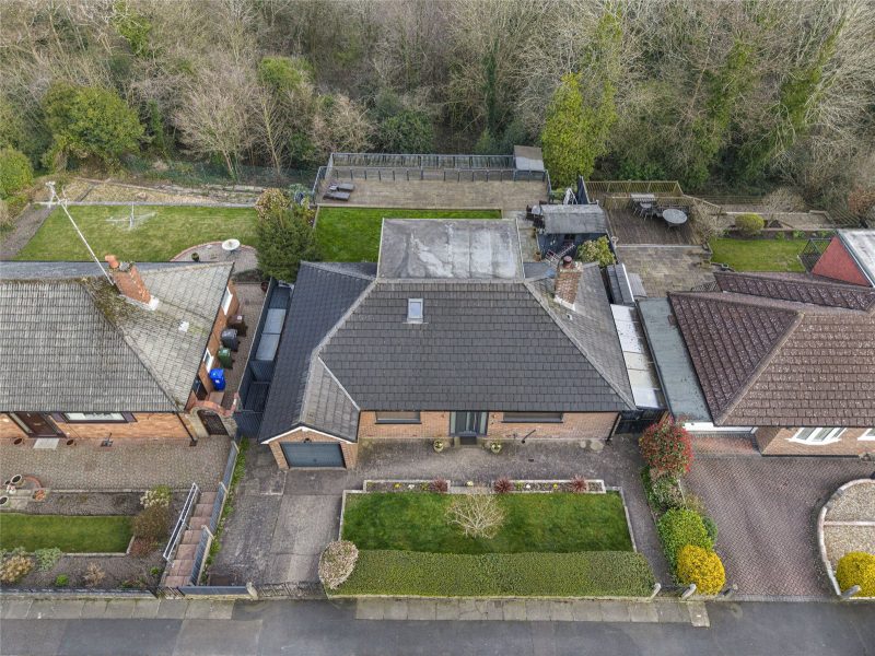 Exceptional four bedroom detached bungalow with panoramic valley views, versatile living space and stunning tiered gardens.