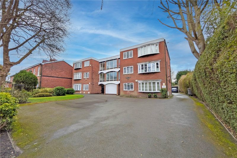 Spacious two-bedroom apartment with garage and parking in a quiet rear-facing position.