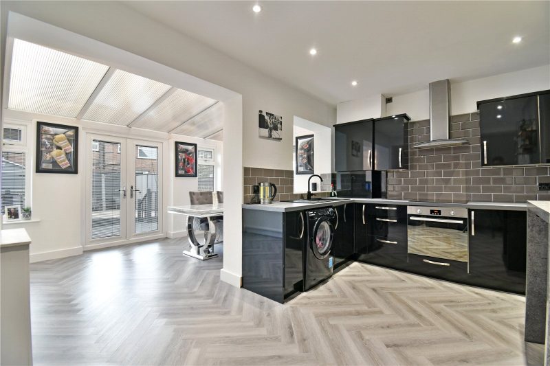 Beautifully renovated two bedroom mid-terrace with loft room, driveway and landscaped garden.